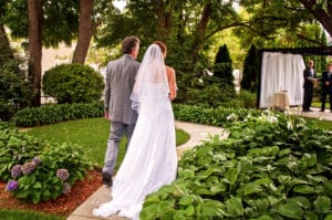 Wedding Venues in Michigan, bride walking down the aisle with her dad at the Historic Webster House