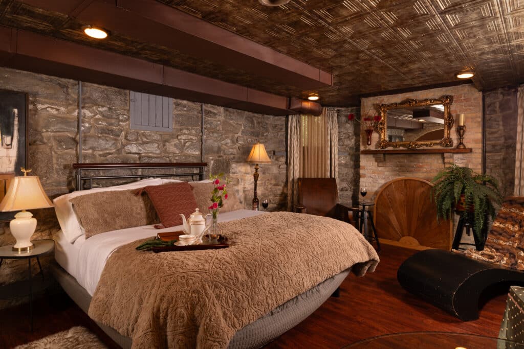 The Best Bed and Breakfast in Michigan near Frankenmuth 7 A king bed with luxurious linens in The Keep Room at the Historic Webster Inn, the best Bed and Breakfast in Michigan.