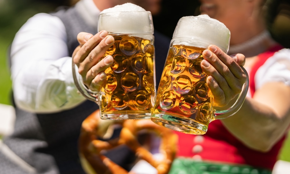 What to Do in Frankenmuth This Fall 4 Man and woman holding beer. If you are looking for what to do in Frankenmuth this fall, consider Oktoberfest.